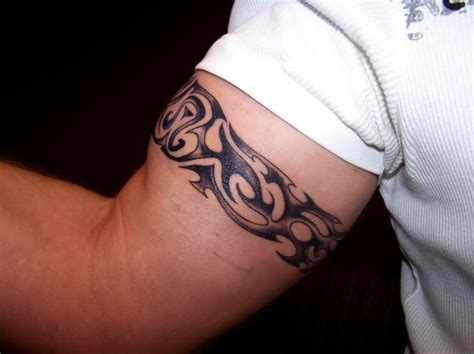 Tattoo design on biceps | tattoo ideas | arm band tattoo, bicep | Tatuagem bracelete masculino ...