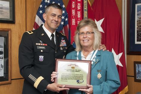 Commander honors local woman for service to Soldiers' Families ...