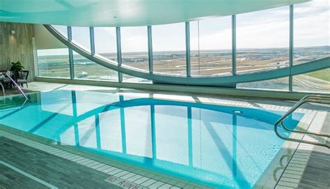 Westin Denver International Airport Pool Shimmers Behind Glass Curtains