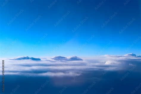 view from window of plane to white clouds Stock Photo | Adobe Stock