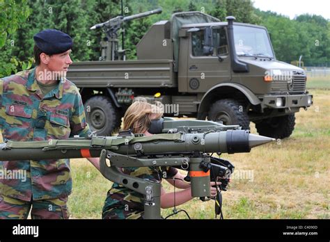 Soldier showing Mistral Air Defence Missile System to child during open day of the Belgian army ...