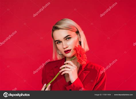 Attractive girl with red flower — Stock Photo © Y-Boychenko #173511404