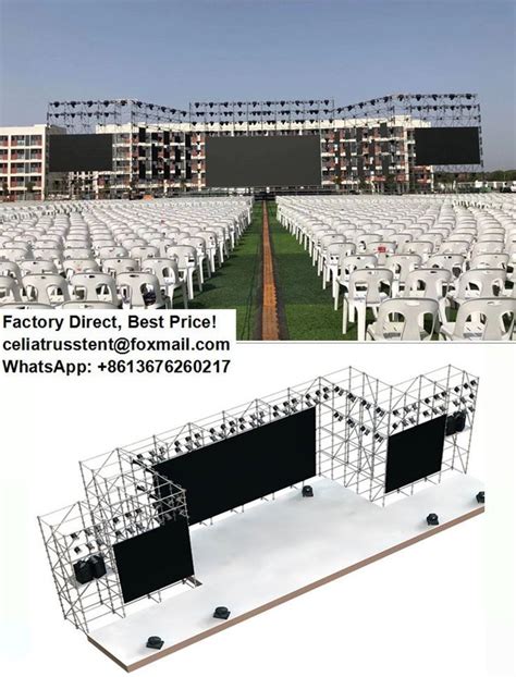 an outdoor event with rows of white chairs and black screens on the ...