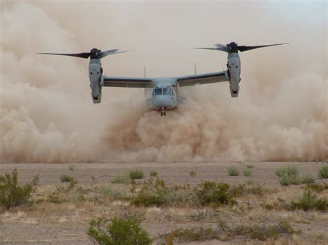 A Marine Corps MV-22 Osprey takes off in a cloud of dust [2048 × 1536] : r/MilitaryPorn