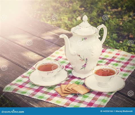 Vintage Picture of Tea Cups and Teapot on Wooden T Stock Photo - Image of rustic, table: 44326166