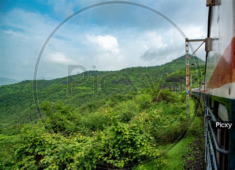 Image of Train journey from Lonavala to Mumbai during Monsoon.-UT330866-Picxy