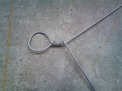 File:Staircasepuzzle-bending wire to form a pole 2.jpg