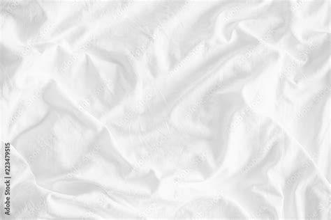 White wrinkled fabic texture rippled surface,Close up unmade bed sheet ...