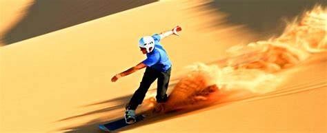 Sandboarding and skiing on Dubai desert