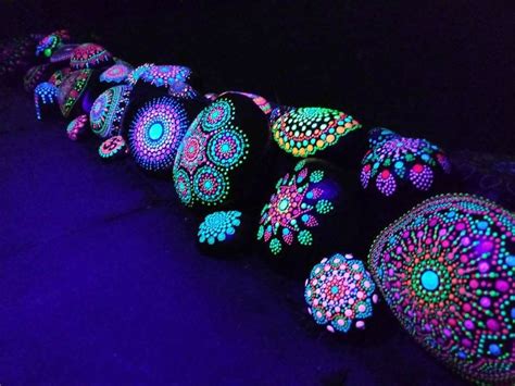 Black stones with glow paint!! | Painted garden rocks, Painted rocks, Glow rock