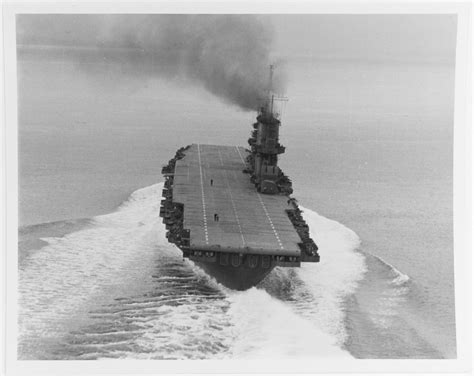 USS Saratoga (CV-3) underway in Puget Sound with a stern view of her flight deck and 5"/38 ...