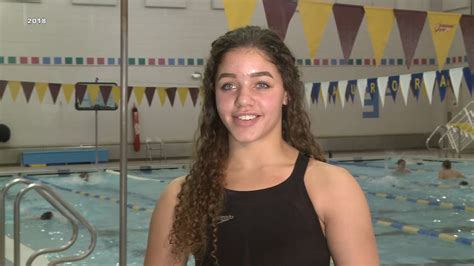 Decision reversed on high school swimmer disqualified over swimsuit ...