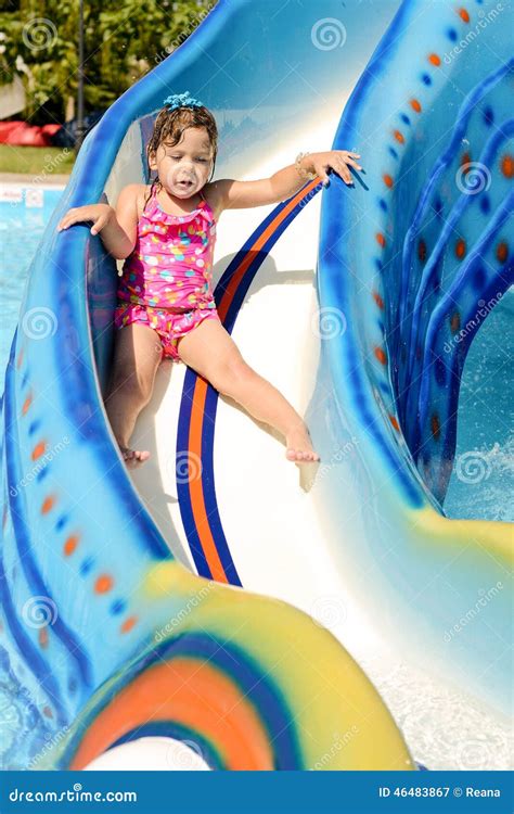 Toddler girl in aqua park stock image. Image of laughing - 46483867