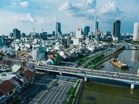 Sunset Drone Photo of Apartment Buildings in District 4 at Saigon River with View of Houses and ...