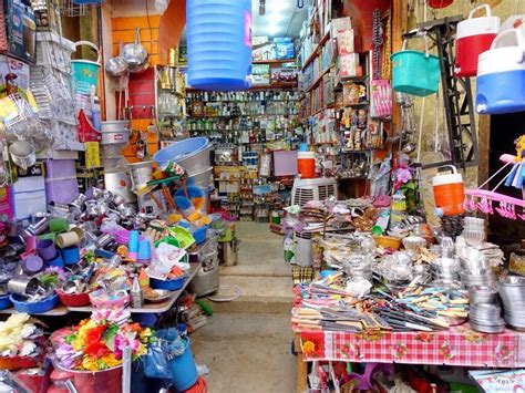 a store filled with lots of different types of items and containers on tables next to each other