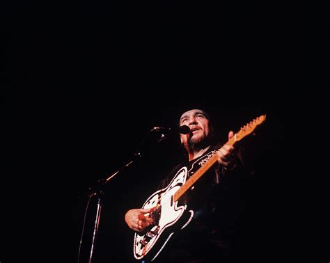 Waylon Jennings Performs On Stage Photograph by David Redfern