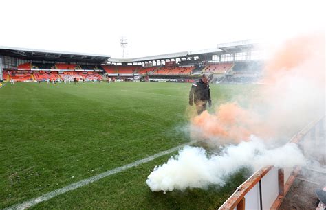 Dundee United fans lob flares onto pitch during Celtic game | The ...