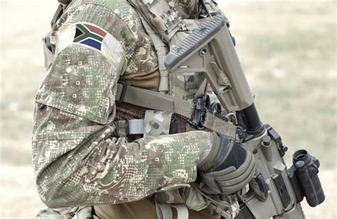 Soldier with Assault Rifle and Flag of South Africa on Military Uniform ...