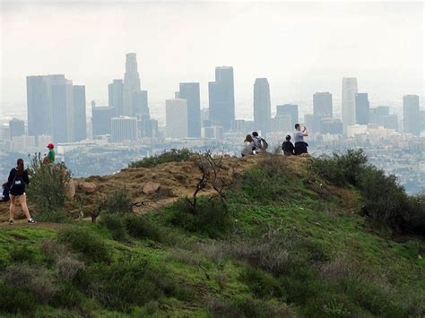 Hikers check out the downtown skyline on a Hollywood Hills Hiking Tour Explore California ...