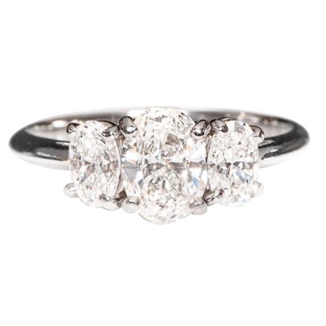 Tiffany and Co. Oval Brilliant Cut Diamond Platinum Three Stone Ring For Sale at 1stdibs