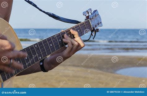 Young Boy Playing Acoustic Guitar on the Beach Stock Photo - Image of ...