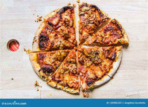 Delicious Round Pizza Cut in 8 Slices on Wood Board Stock Photo - Image of wood, crumbs: 120986332