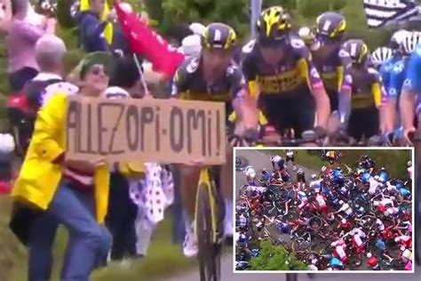 Police hunt for female Tour de France fan who caused massive crash with sign amid warning she ...