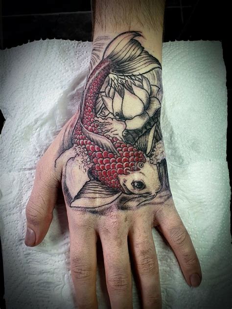 Details 72+ fish hand tattoo best - in.cdgdbentre