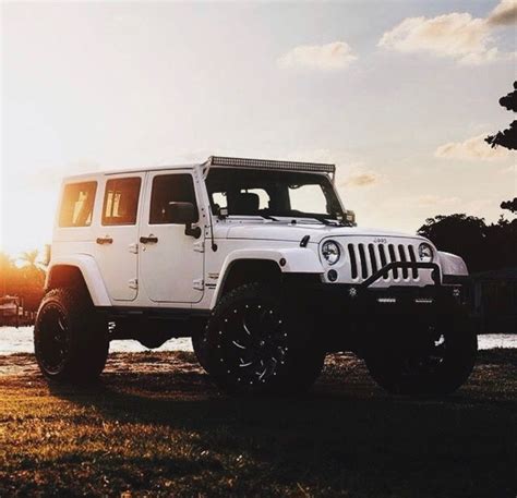 White 4 Door Jeep Wrangler