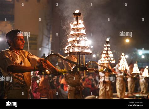 Evening Ganga Aarti (aarthi) Hindu religious spiritual ritual and ceremony with fire and smoke ...