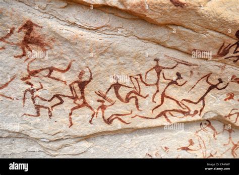 Group of painted warriors or hunters, neolithic rockart at Arakokem ...