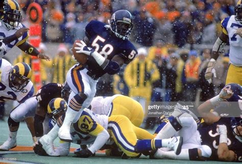 Wilber Marshall of the Chicago Bears recovers a fumble and returns it ...