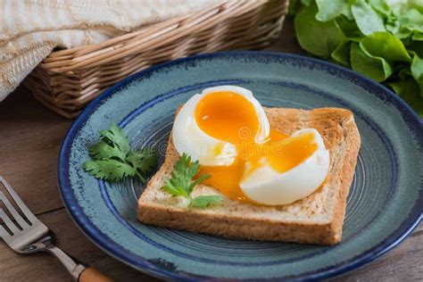 Soft Boiled Egg with Toast on Blue Plate Stock Image - Image of leaf ...