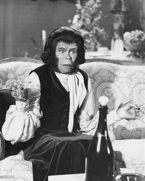 Actress Kim Hunter as Zira, partaking in a drink of champagne in a scene from the film 'Escape ...