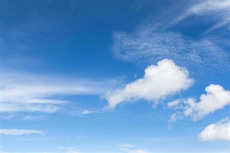 White fluffy clouds in the blue sky 11215802 Stock Photo at Vecteezy