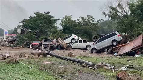 Ten dead and dozens missing after record rain and flash floods in ...