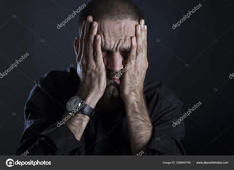 Tired frustrated man covering face with hands. Stock Photo by ...