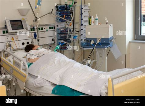 Patient In Hospital Bed Icu