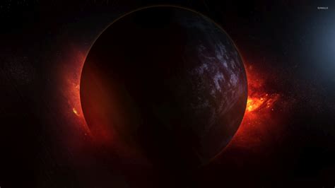 Red nebula hiding behind the dark planet wallpaper - Space wallpapers ...