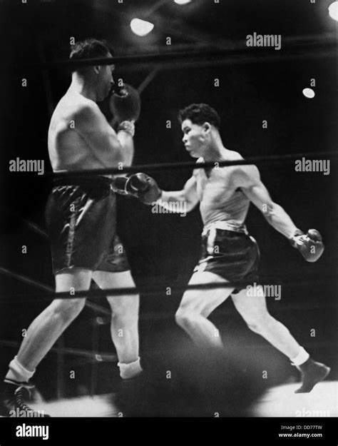 Joe Louis (right) in boxing match with Jack Sharkey at Yankee Stadium, New York. August 18, 1936 ...