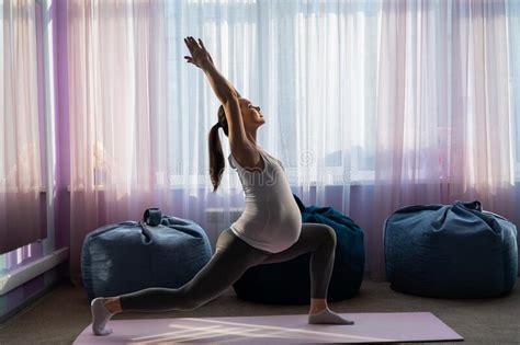 Pregnant Woman Practice Yoga. a Girl in the Third Trimester Leads Pilates. Classes To Prepare ...