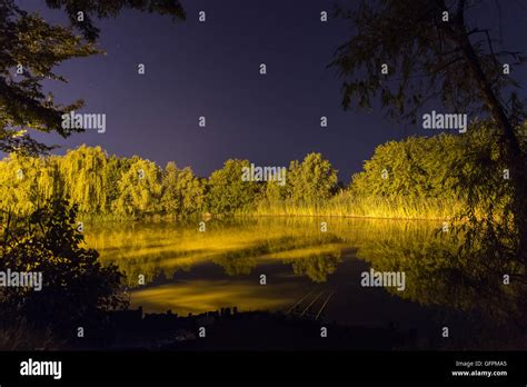 Beautiful Night Reflection on lake, Nightfishing Stock Photo - Alamy