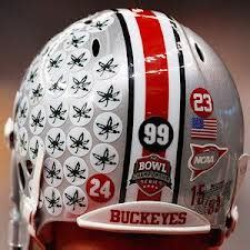 collegiate - Why are there stickers on helmets of football players in ...