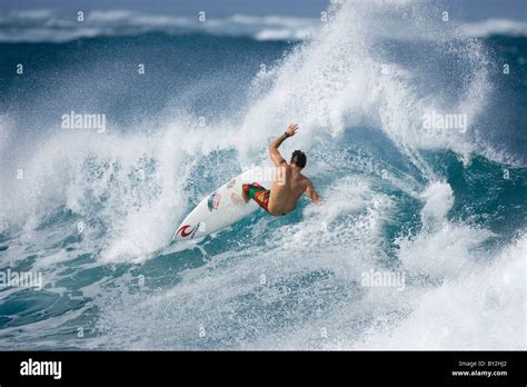 A young man surfing at Turtle Bay, on the north shore of Oahu, Hawaii Stock Photo - Alamy