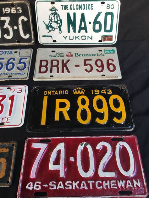 COLLECTION OF 8 VINTAGE CANADA LICENSE PLATES