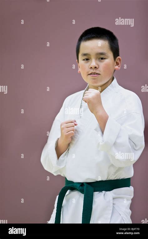 Karate student green belt Stock Photo - Alamy