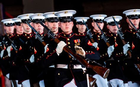 The U.S. Marine Corps Silent Drill Team performs during the evening ...