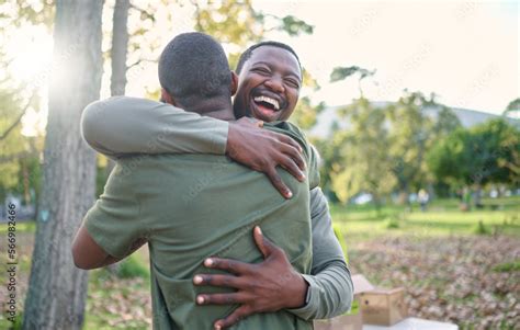 Charity, happy and hug with volunteer friends in a park for community, charity or donation of ...