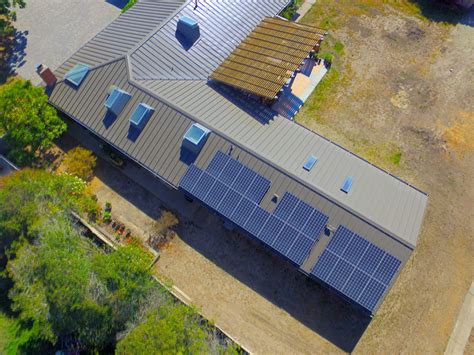 MONOCRYSTALLINE PANELS MOUNTED ON A METAL ROOF - Brighten Solar Co.