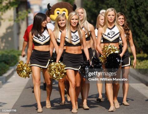 The Colorado Buffaloes cheerleaders followed by their mascot Chip ...